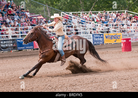 Cowgirl riding fast during barrel racing, Strathmore Heritage Days, Rodeo, Strathmore, Alberta, Canada Stock Photo