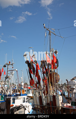 Buoy markers with flags and equipment on fishing boats in Gilleleje Harbour, Denmark Stock Photo