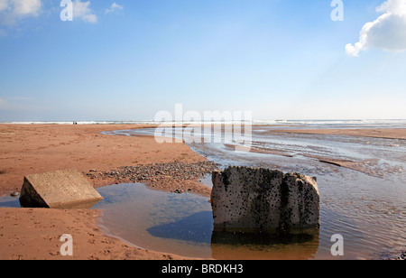 Lunan Water flowing to the sea across the beach at Lunan Bay, Angus, Scotland, United Kingdom. Stock Photo