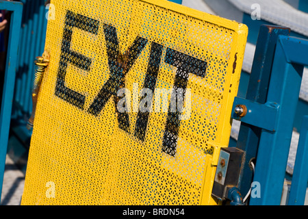 Exit Sign with yellow background Stock Photo