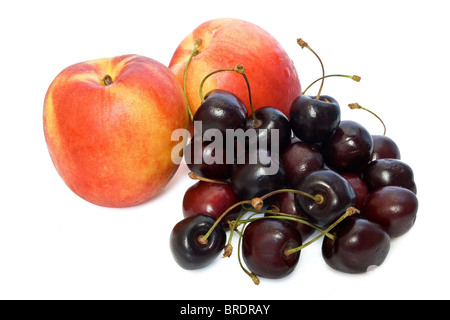 two nectarines and cherries isolated on white background Stock Photo