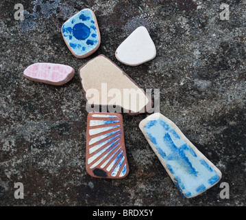 Painted stones, pebbles placed to form a face and a man Stock Photo