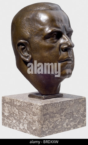Ferdinand Liebermann (1883 - 1941), a bronze head - Max Amann Expressive portrayal of the President of the Reich Press Chamber. Finely patinated. Back of the nape with recessed artist's signature 'Ferd. Liebermann', on side of base the foundry name 'Brandstetter München'. Plinth of polished shell-limestone. Height 40.5 cm. Ferdinand Liebermann completed his education at the Munich Art Academy. In 1910 he was awarded the Great Austrian State Medal for a bronze sculpture. After 1933 he received a large number of state commissions and was highly regarded by Hitler, Stock Photo
