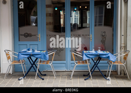 Street pavement tables and chairs outside a typical French restaurant in Northern France Stock Photo