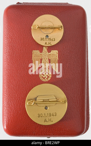 District Instructional Leader August Schöllhorn - a set of golden party badges, personally awarded by Adolf Hitler The 30 mm as well as the 24 mm non-ferrous metal Deschler type issue with reverses engraved '30.1.1943 - A.H.', vent holes and lateral pin attachments. Gilt, with silvered medallions. Red leather dual case with gold-stamped eagle, sand coloured cushion (stained, and the notches are cut for the vertical attachment pin variety), light coloured silk lining. The ca. 650 awards with engraving were recognized as personal praise by Hitler. Among the award, Stock Photo