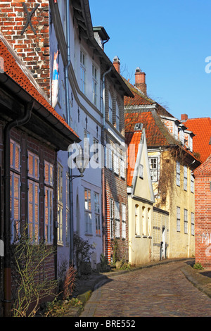 Romantic alley, old cobbled street with historic houses in the city centre, hanseatic city of Lueneburg, Lower Saxony Stock Photo