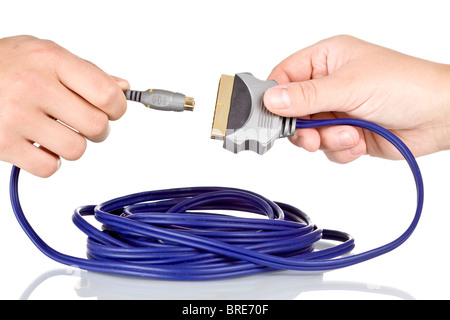 Hands connecting two cables on white background Stock Photo