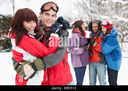 Group Of Teenage Friends Having Fun In Snowy Landscape Wearing Ski Clothing Stock Photo