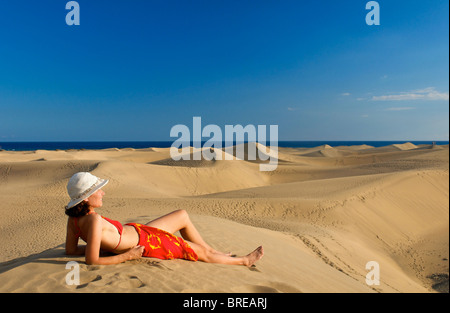 Woman in the dunes of Maspalomas, Gran Canaria, Spain Stock Photo