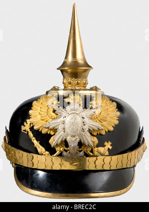 A helmet for reserve officers, of the III Battalion of the 7th Thuringian Infantry Regiment No. 96 Leather skull with gilt tombac mountings, line unit eagle without the Fatherland scroll, and the silver star and coat of arms of Schwarzburg-Rudolstadt as well as the Landwehr cross with the motto, 'Mit Gott für Fürst...' (With God for Prince...), officer's cockades in blue/silver, and the imperial cockade. Brown ribbed silk lining. The gilding is still well preserved on all pieces. The helmet skull has probably been retouched. Size 56 1/2. Extremely rare helmet, , Stock Photo