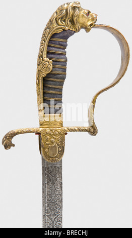 A presentation sabre with a Damascus blade, to a Prussian artillery officer Curved pipe-backed blade of forged Damascus (sharpened, cleaned) with yelmen and decorative floral etching on the upper half along with the dedication, 'J.W. Colsman s/l R. Bäuerle - 1910' with a student fraternity logo, and the maker's mark 'WKC'. Gold-plated knuckle-bow hilt with a lion head grip cap (with red glass eyes) and abundant floral decoration in relief. The obverse languet bears crossed cannon barrels. Black sharkskin grip cover with wire winding. Black lacquered steel scabb, Stock Photo