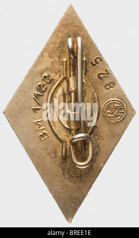 A Golden Hitler Youth Honour Badge, with oak leaf border 1934 - 1941 Silver gilt, enamelled. Reverse wire attachment pin, manufacturer 'BM/1/122' for Deutschbein GmbH, Euskirchen and wearer number '825'. Weight 3.92 g, 19.46 x 32.74 mm (OEK 3766/2). Included is a Niemann expertise dated March 2007. historic, historical, 1930s, 1930s, 20th century, awards, award, German Reich, Third Reich, Nazi era, National Socialism, object, objects, stills, medal, decoration, medals, decorations, clipping, cut out, cut-out, cut-outs, honor, honour, National Socialist, Nazi, N, Stock Photo