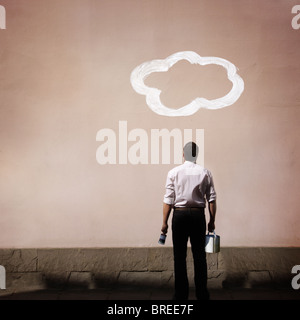 man with cloud painted on wall Stock Photo