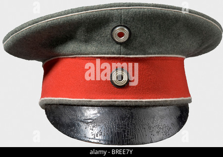 A field grey model 1908 cap for officers, of the Garde du Corps Regiment Field grey cover, poppy-red band, white piping, officer's cockades, and black-lacquered leather peak. Lining shows clear signs of wear. Fresh colour, clean, and a tiny, repaired moth hole. historic, historical, 1900s, 20th century, Prussian, Prussia, German, Germany, militaria, military, object, objects, stills, clipping, clippings, cut out, cut-out, cut-outs, uniform, uniforms, clothes, piece of clothing, headpiece, headpieces, cap, caps, hat, hats, bonnet, bonnets, accessory, accessories, Stock Photo