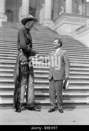 Vintage photo c1919 of 7ft 6in tall Ralph 'Tex' Madsen (1897 - 1948) - the so-called 'tallest cowboy in the world'. Stock Photo