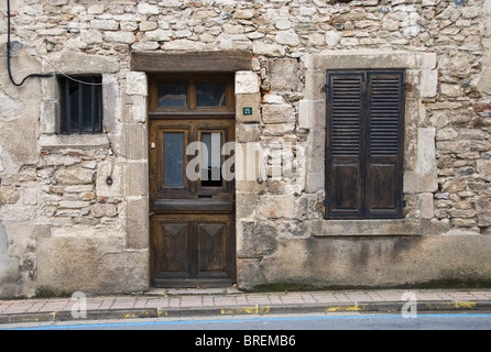 The facade of an old stone cottage in a French village, in the Indre region, France Stock Photo