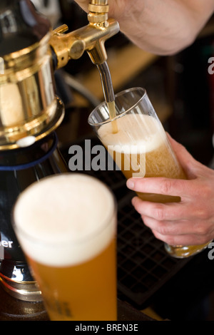 The Crown a popular pub for beer and food in Islington London. Draught beer pump Stock Photo