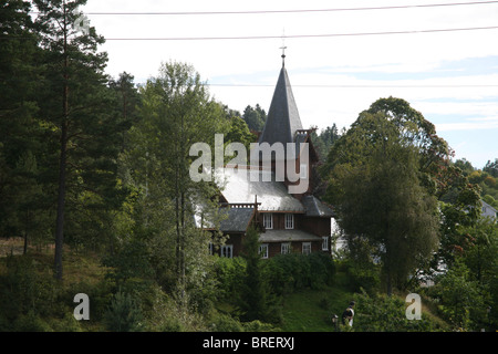 The old stave church, built in 1903, was a gift from Bolette Olsen. Hvitsten Stock Photo