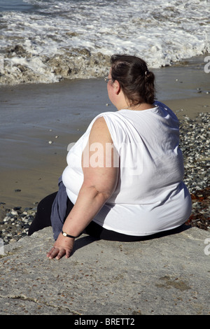 Naked obese woman sitting Stock Photo - Alamy