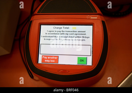 credit card processing machine at Target signature page screen ok pay another way sign payment pay store shopping cashier swipe Stock Photo