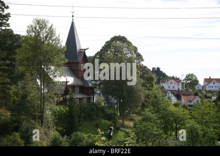 The old stave church, built in 1903, was a gift from Bolette Olsen. Hvitsten Stock Photo