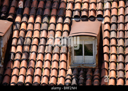 Tile roof with closed window, Rijeka, Croatia Stock Photo