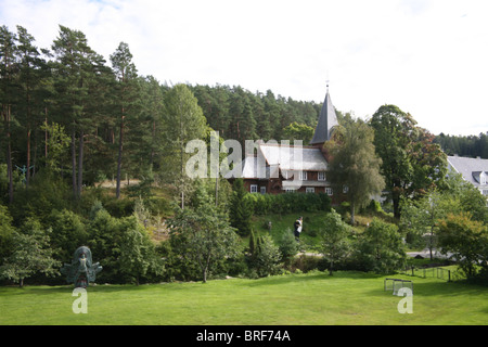 The old stave church, built in 1903, was a gift from Bolette Olsen. Hvitsten Stock Photo