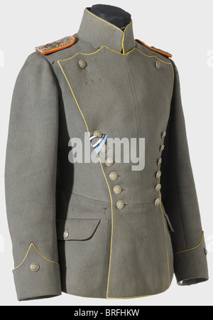 A model 1908 ulanka(lancer's tunic)for a Lieutenant,of the Uhlan Regiment König Wilhelm I(2nd. Württemberger)No. 20. Field grey knitted fabric,lemon yellow piping,nickel buttons with stamped crowns. Model 1915 shoulder boards in field grey,red/golden backing,and a 'W.I.' cipher. A tailor's tag for Gustav Gfrörer,Stuttgart. Several small moth holes. Rare. historic,historical,1900s,1910s,20th century,Wuerttemberg,Wurttemberg,Württemberg,Southern Germany,the South of Germany,south german,object,objects,stills,clipping,clippings,cut out,c,Additional-Rights-Clearences-Not Available Stock Photo