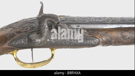 A pair of percussion pistols,Johann Andreas Keuchenreuter,Steinweg near Regensburg,circa 1760.Smooth bore,reblued barrels in 12 mm calibre with silver 'spider' front sights and two-piece folding rear sights.A chiselled hunting scene in relief on the breeches with brass-filled rider marks(Stöckel,No.7717).The sighting flats are signed,'IOH.AND.KUCHENREUTER' in gold and silver.Percussion locks nicely converted from flint,with stags in front of a forest backdrop cut into the lock plates in relief.Single set triggers.Lavishly carved walnut stocks(,Additional-Rights-Clearences-Not Available Stock Photo