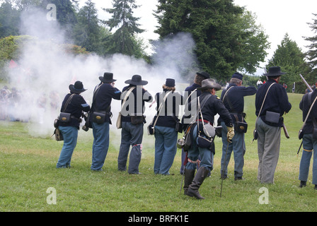 Union infantry line firing a volley, Civil War Battle Re-enactment, Port Gamble, WA Stock Photo
