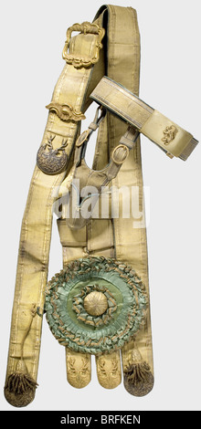 A festive hunting bandolier and belt,Electorate of Hesse,middle of the 19th century.Broad gold lace on green Morocco leather with finely worked and chiselled fittings of fire-gilded bronze and silver with oak leaf and stag antler decoration.Large horn cord of folded green silk with gold braid.Two gold bullion tassels.Length ca.120 cm.The belt manufactured en suite with adherent frog for the hunting hanger and a brass lock with an uncrowned,standing lion.Presumably from the possessions of Oberjägermeister Ferdinand von Baumbach.historic,historical,1,Additional-Rights-Clearences-Not Available Stock Photo