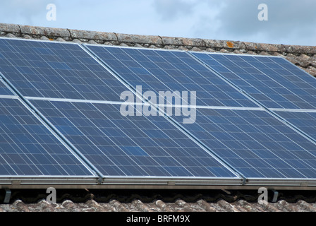 Solar Electricity Panels on domestic house roof Stock Photo