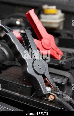 car battery booster cables starting old car battery in cold weather Stock Photo