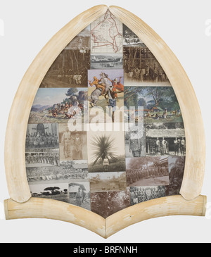 Philipp Waizmann - souvenir photos from Africa in an ivory frame.,23 photographs and postcards,including interesting pictures of African soldiers and of a marching band of tribesmen in uniform. On a shield-shaped wood board,framed by four halves of elephant tusks cut lengthwise. On the verso a loop for wall mounting. Ca. 71 x 61 cm. Impressive oddity. historic,historical,people,1900s,1910s,20th century,navy,naval forces,military,militaria,branch of service,branches of service,armed forces,armed service,object,objects,stills,clipping,clippin,Additional-Rights-Clearences-Not Available Stock Photo