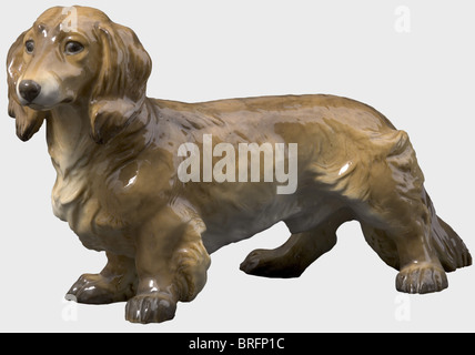 A longhaired dachshund, designed by Ottmar Obermaier. Model number '75'. Colour-glazed porcelain. Model number, and pressmark 'SS-Allach' on the belly. Height 19 cm. historic, historical, 1930s, 1930s, 20th century, object, objects, stills, clipping, clippings, cut out, cut-out, cut-outs, Additional-Rights-Clearences-Not Available Stock Photo