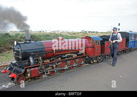 One-thirds scale steam locomotive 'Hercules' operating on the Romney, Hythe and Dymchurch railway, Dungeness, Kent, England. Stock Photo