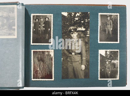 A private photo album,of a member of the SS-War Reporters,Company 5 Circa 100 photographs,mostly military,in a brown leather-bound album. After basic training in the SS,he was on his way in his own service vehicle to Russia,together with his cameraman Oberscharführer Hulle. Many photos show him and his fellow soldiers in camouflage uniform. Once Hulle,wearing his Iron Cross I,appears in the black panzer uniform. Sometimes,pictures show him wearing the sleeve band 'SS-Kriegsberichter'(SS-War Reporter). There are scenes of winter fighting,burning villa,Additional-Rights-Clearences-Not Available Stock Photo