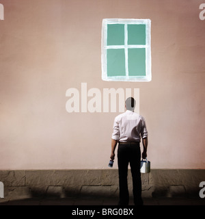 man standing in front of a painted window Stock Photo