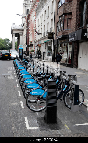 Rows of bicycles in St Georges Street, part of the Barclays Cycle Hire bicycle sharing scheme launched in London in 2010. Stock Photo