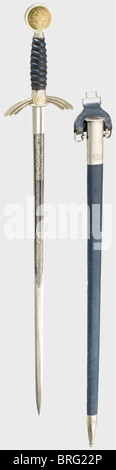 A Luftwaffe honour sword.,Double-ridged sword blade,blued,decorative floral etching with the dedication inscription,'Ehrenpreis für herrvorragende Leistungen auf der Militärärztlichen Akademie'(Award for outstanding achievement at the Academy for Military Medicine).SMF maker's mark,Solingen,and Luftwaffe acceptance marks.Silver-plated and partially gilded non-ferrous metal quillons and pommel.Pommel and scabbard fittings are surrounded with oak leaf engraving.Blue leather grip cover with wire winding.Blue leather-covered scabbard with silver-plated ,Additional-Rights-Clearences-Not Available Stock Photo