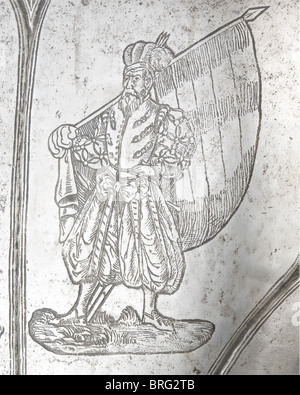 An etched German back plate for a suit of armour,circa 1580,some of the etching done later. Back plate made in one piece with shaped shoulder blades,and turned under and corded rims. Embossed decorative lines with a cruciform mark in the region of the lower back. Fine original black etching of elaborate martial trophies along the edges. Additional etchings showing two Landsknechts added during the Historismus period. Height 37 cm. Provenance: Paul Collection,Berlin. historic,historical,16th century,defensive arms,weapons,arms,weapon,arm,fighting dev,Additional-Rights-Clearences-Not Available Stock Photo