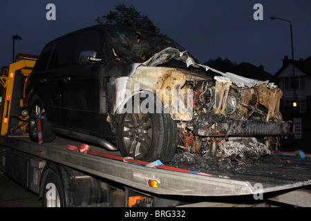 An accident damaged Range Rover on a recovery truck in the U.K. Stock Photo
