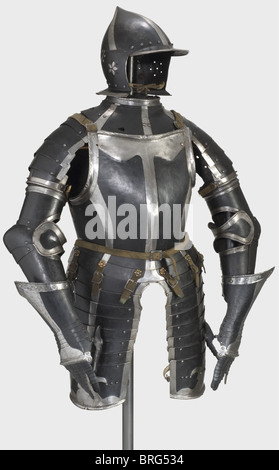 A black and white three-quarter armour,Nuremberg,circa 1540/50 Burgonet with a skull forged in one piece and rising to a point with four raised decorative strips.Brim and neck protector are worked en suite and have rolled,corded rims.A plume socket riveted at the nape of the neck.Hinged cheek flaps with six ear holes and embossed floral designs.Hinged gorget with pauldrons sliding on five lames.Two collar plates,the top one with a turned-under and corded flange.Heavy breastplate with laminated gussets and two taces.Attached tassets sliding on eight l,Additional-Rights-Clearences-Not Available Stock Photo