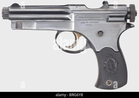 A Roth-Sauer self-loading pistol,shooting prize,calibre 7.65 mm Roth-Sauer,no.B397.Matching numbers.Bright bore.Austrian proof mark from 1909.7-shot.Rotary locking lugs,cocking lock.Barrel housing marked on top: 'J.P.Sauer & Sohn,Suhl' and 'Patent Roth'.4-line dedication engraved on bolt plate 'PREISSCHIESSEN / DER RESERVEOFFIZIERE / DES 8.CORPS / 1914'.Completely flawless blue-black high gloss finish,originality not guaranteed,possibly after engraving.Small parts yellow and blue,lock polished white.Hard rubber grip panels with matching num,Additional-Rights-Clearences-Not Available Stock Photo