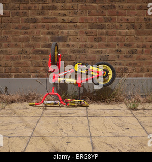 discarded childs bike, peckham, south london. Stock Photo