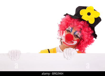 clown holding and looking to a blank banner (isolated on white) Stock Photo