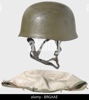 A steel helmet for paratroopers,2nd model Painted olive brown in the field(wear-related defects),the original blue-grey paint lies underneath.Interior stampings '172' and 'ET 68',aluminium inner ring with light rubber padding,blue grey leather strapping and neutral colour leather liner fastened with four screws,maker's mark 'Heisler Berlin 2' and 'Kopfweite: Gr.56 - Stahlhelm: Gr.68'.Signs of wear.Complete with the rare 'Sumpftarnmuster' camouflage cover with attachment bands for the camouflage material and six non-magnetic hook fasteners.,historic,,Additional-Rights-Clearences-Not Available Stock Photo