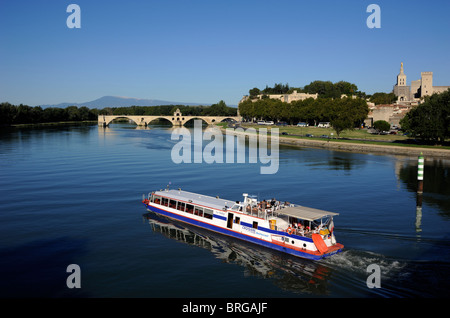 France, Provence, Avignon, Rhône River cruise boat, Saint Bénézet bridge and Papal Palace Stock Photo