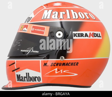 Michael Schumacher,a racing helmet of the seven-time Formula 1 world champion,2002 season The visor with signs of use,handsigned by Michael Schumacher.Authentically produced in limited quantity,this authorised replica bears a special airbrush painting and seven stars for his seven world championship titles in the 'starry sky'(from 2004).Provenance: Donington Grand Prix Collection,exhibited also at the Goodwood Festival of Speed or the Retromobile in Paris.When one of Schumacher's helmets was stolen from the Brunswick manufacturer in 2002,the object va,Additional-Rights-Clearences-Not Available