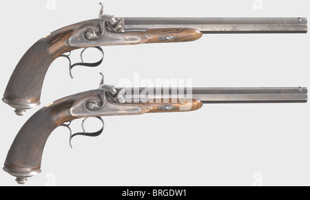 A cased pair of percussion pistols,N.Guyot,Paris,circa 1850.Octagonal blued barrels with patent breechblocks and narrow groove rifling in 11.5 mm calibre.The tops of the barrels are finely engraved with 'Guyot Arg.12 Rue de Ponthieu,Paris'.Colour case hardened locks with fine ornamental engraving.Walnut stocks with checkered butts and colour case hardened iron furniture engraved en suite.Blank gold escutcheons.Length of each 43.5 cm.In a felt-lined wooden case with brass reinforcements on the corners containing a complete set of accessories.The co,Additional-Rights-Clearences-Not Available